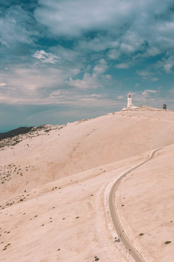 A beautiful view of a building on a hill under the cloudy sky in Mont ventoux, France
